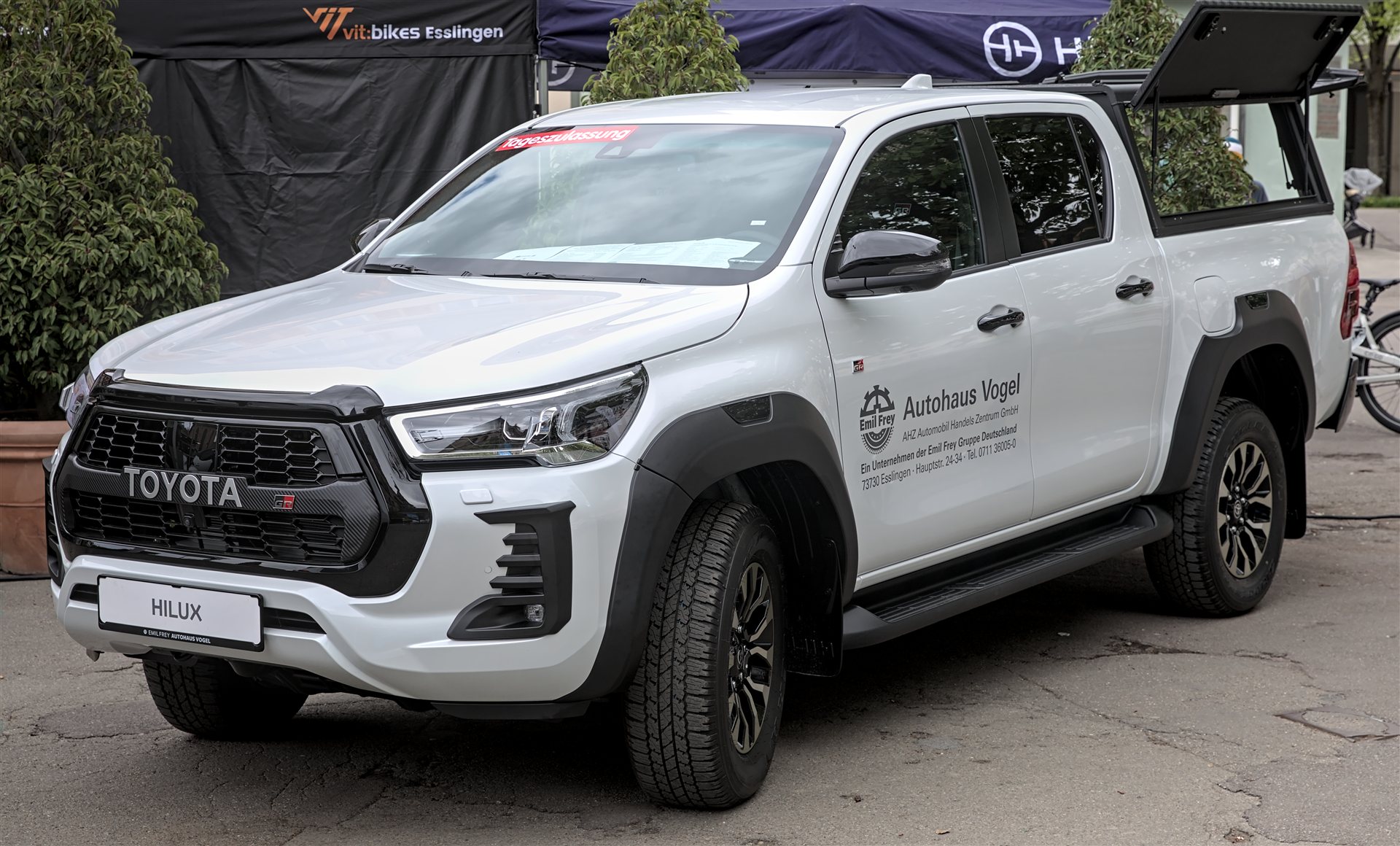 Illustrative Toyota Hilux pickup (prior-generation GR Sport shown; ninth-gen BEV design differs)